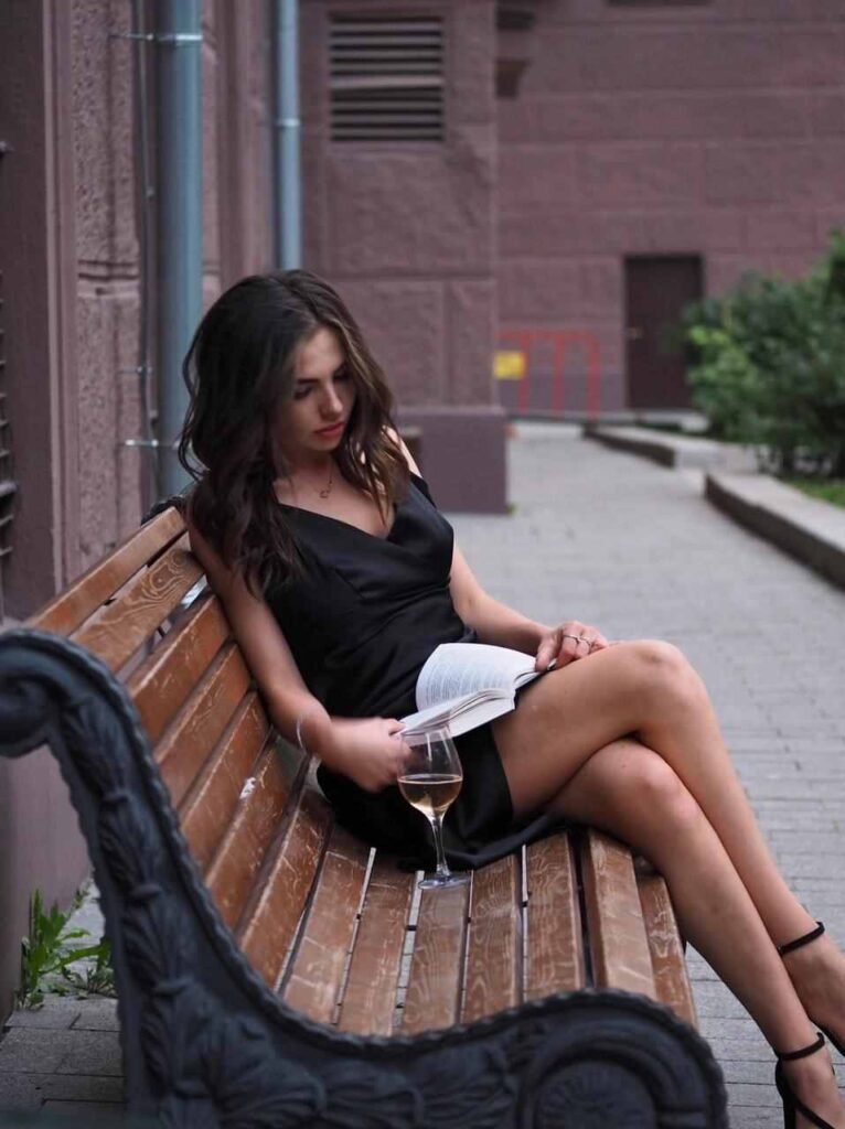 Ira-reads-in-black-dress